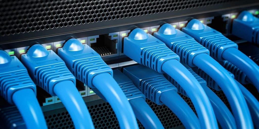 Network LAN internet cables connected in network switches. Server in data center.